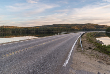 Empty road between lakes in Lapland.