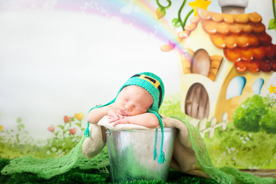 Sleeping newborn baby in a St. Patrick's Day hat