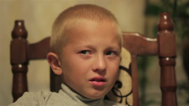 boy is crying at the table