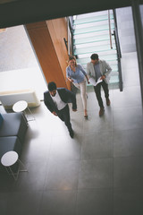 Business people at work. Activity business people walking trough building.