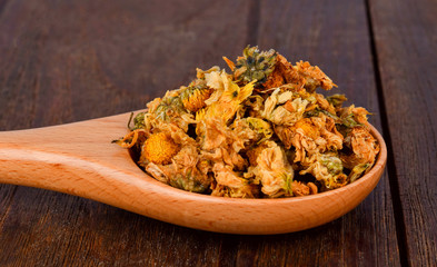 Dried Chrysanthemum flowers on wood