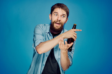 1368114 Man holding a bottle of beer