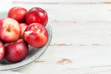 Fresh Nectarines in Rustic Ceramic Plate