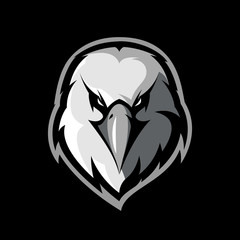 Furious eagle head athletic club vector logo concept isolated on black background.