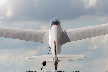 sailplane beeing towed in the air