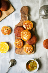 Cookies with almonds on a wooden board, laid out for tea in a rustic style, top view