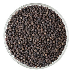 Black pepper corns in glass bowl isolated on white background with clipping path