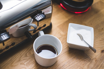 coffee mug with coffee machine and sugar