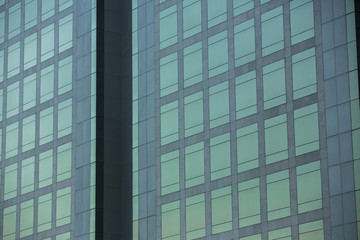Modern architecture close up with mirror window reflection. Bangkok Thailand