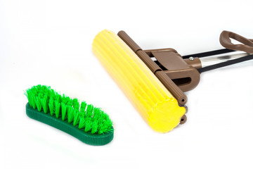 green cleaning brush and Mob cleaning tool on white background