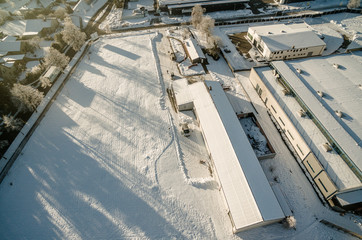 Aerial photo in winter, hall in the snow from sloping point of view