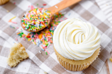 Tasty cupcakes on a white wooden table