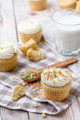 Tasty cupcakes on a white wooden table