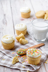 Tasty cupcakes on a white wooden table