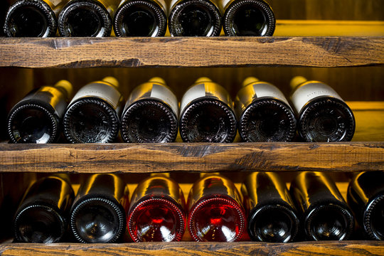 Fototapeta wine bottles on wooden shelves