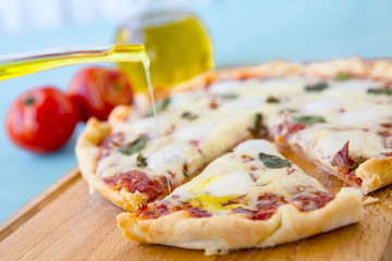 pizza with bacon, mozzarella on a blue background