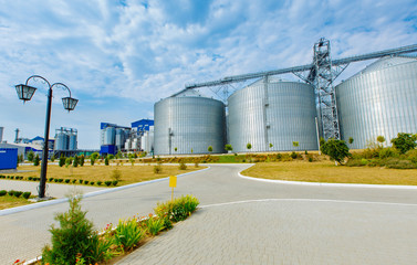 Grain elevator in agricultural zone. Granary with mechanical equipment for receiving, cleaning, drying, grain shipment.