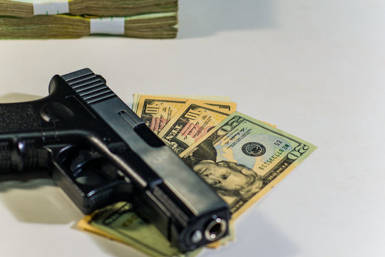 Gun and money concept