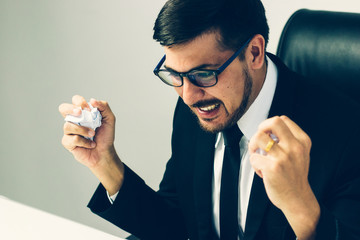 Stressed Senior businessman holding document binders on his head, Unsuccessful overworked people