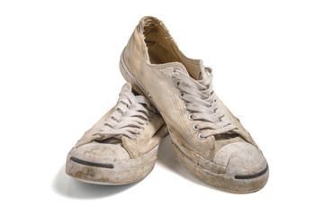 Old white shoes isolate
