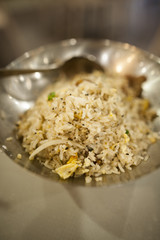 That looks like a mouthwatering meal. Close-up shot of a bowl of delicious Chinese fried rice.