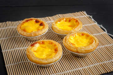 egg tart on black wood