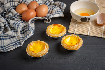 egg tart on black wood