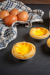 egg tart on black wood