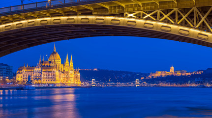 Budapest, Hungary - The beautiful illuminated Parliament of Hungary at blue hour with Szechenyi Chain Bridge and Buda Castle at backgroud