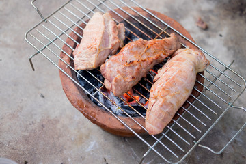 Juicy slices of meat cooking