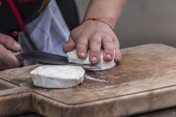 Cut a brie cheese.