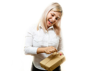 Beautiful female opening gift, closeup woman portrait isolated on white background, pretty blond girl with present box, people celebrating holidays concept