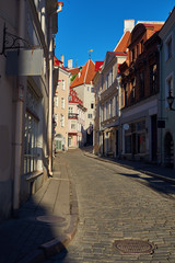 Fototapeta na wymiar One of the streets of the old city on a sunny day without people in Tallinn, Estonia