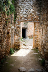 Light and shadows on entrance of a stone corridor in ancient castle,Greece