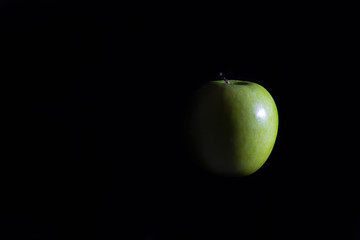 Apple on a black background.