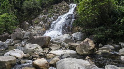 Naklejka na ściany i meble Waterfall in the Vietnamese jungle.