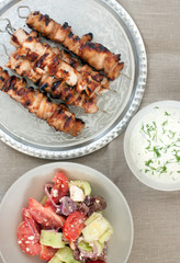 chicken kebabs with Greek salad and yogurt dip