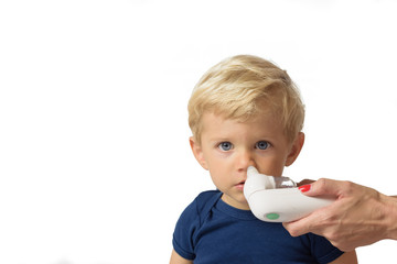 Mother using baby electric nasal aspirator. She is doing a mucus suction to twenty months baby boy,white backgrounds.