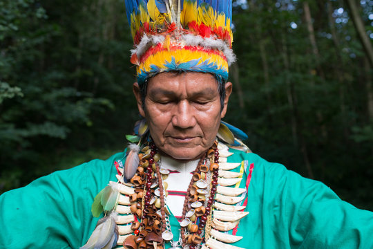 Man in authentic costume posing in woods