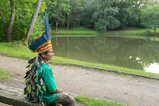 Indigenous man posing on bench