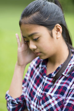 Outdoor Portrait Of Stressed Young Girl