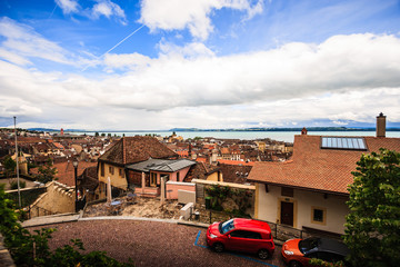 Top view of the medieval town Neuchatel with Lake Neuchatel and the Bernese Alps Chaumont seen on the horizon.