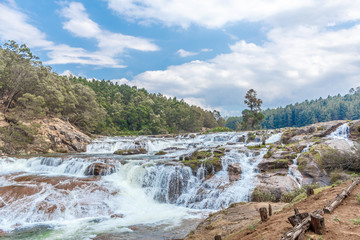 People at Pykara waterfall, Ooty, India - March 14, 2016: Pykara waterfalls flows through Murkurti,...