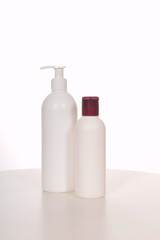 Cosmetics in bottles of plastic containers and tubes