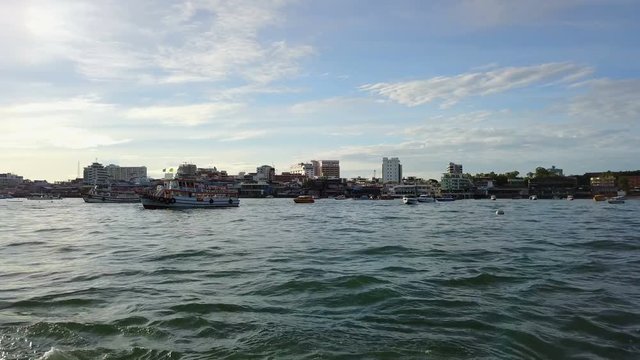 4K Pattaya city and sea with morning sunrise from boat