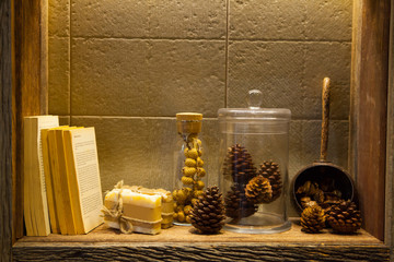 Fototapeta na wymiar Organic Handmade Soap and Pines Cone in glass bottle