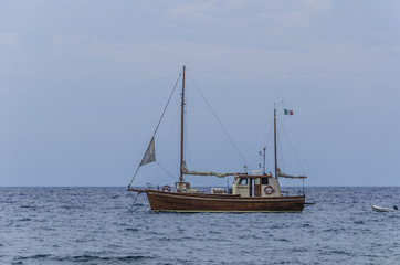 Sailboat on the shores of the island of panarea