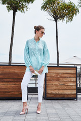 Fashion model brunette woman sexy pretty lady summer mood wear blue blouse white jeans casual...