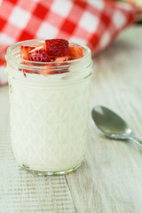 Cup of Fresh Yogurt With Strawberries Vertical