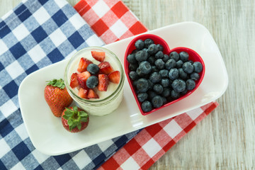 Delicious Yogurt With Strawberries and Blueberries in Heart Bowl